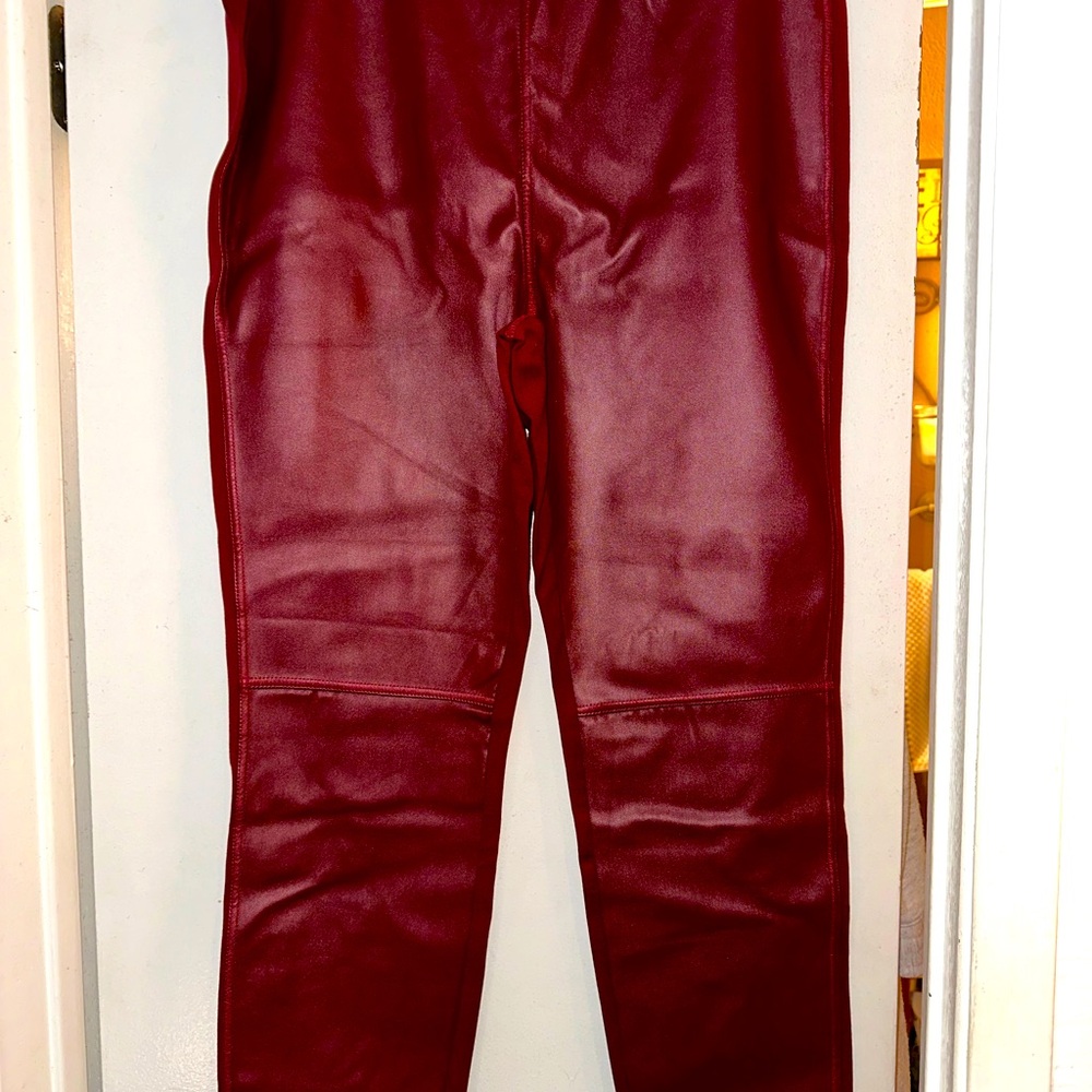 Burgundy faux leather front jeggings.size is more like a women’s 12/W